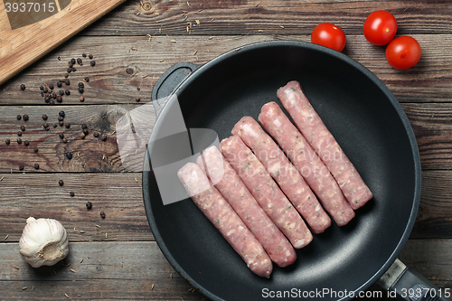 Image of Raw Sausages in a Pan