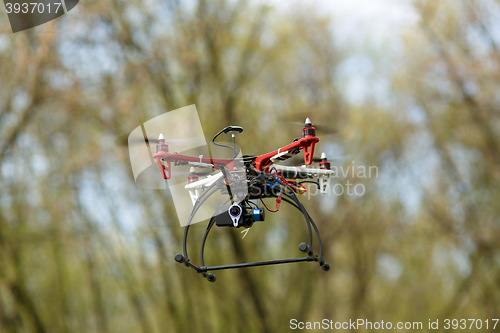 Image of Quadrocopter while flying in the forest. 