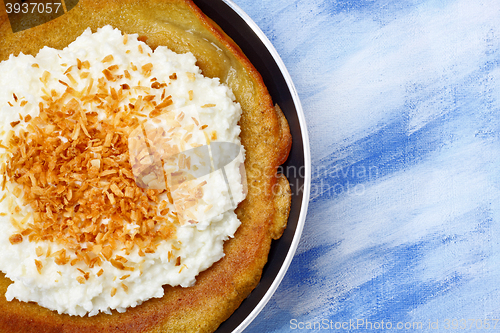 Image of Pancake with cottage cheese and grated coconut topping