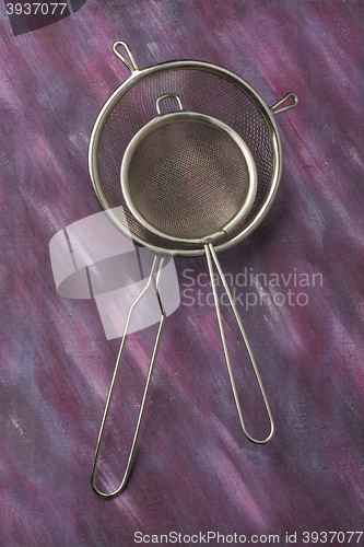 Image of Pair of empty metal kitchen sieves