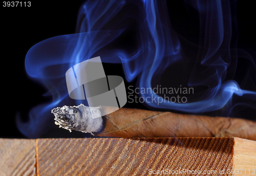 Image of Cigar with abstract smoke