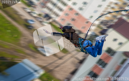 Image of ropejump from an unfinished high-rise building