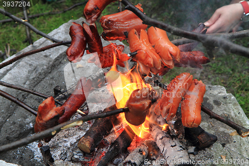 Image of traditional czech sausages and the fire 