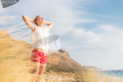 Image of Free Happy Woman Enjoying Sun on Vacations.