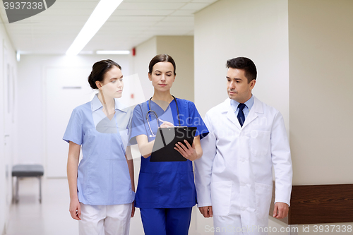 Image of group of medics at hospital with clipboard