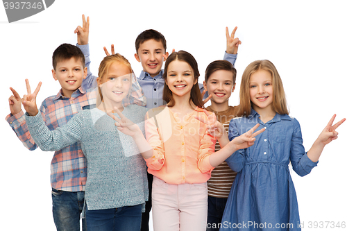 Image of happy children showing peace hand sign