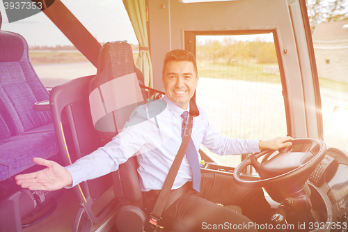 Image of happy driver inviting on board of intercity bus