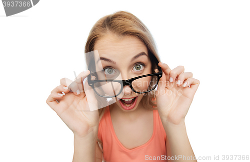 Image of happy young woman or teenage girl in eyeglasses