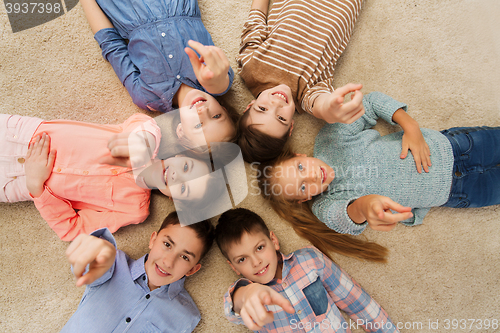 Image of happy children pointing finger to you