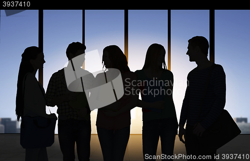 Image of people silhouettes over office background