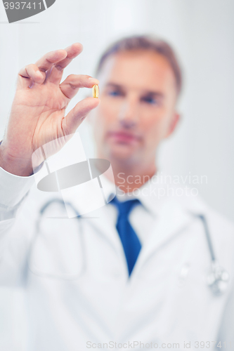 Image of doctor with pill in hospital