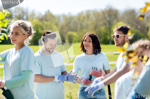 Image of group of volunteers planting tree in park