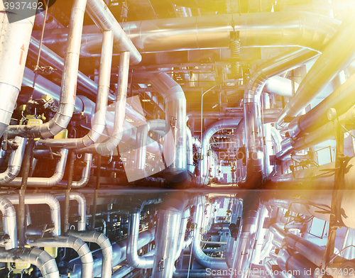 Image of Industrial zone, Steel pipelines in blue tones with reflection