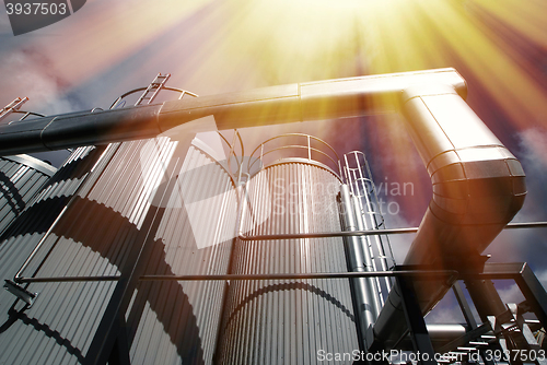 Image of Industrial zone, Steel pipelines and valves against blue sky