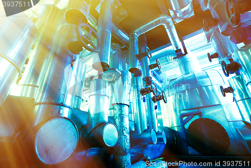 Image of Industrial zone, Steel pipelines, valves and ladders in blue ton