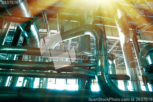 Image of Equipment, cables and piping as found inside of a modern industr