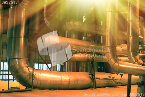 Image of Equipment, cables and piping as found inside of a modern industr