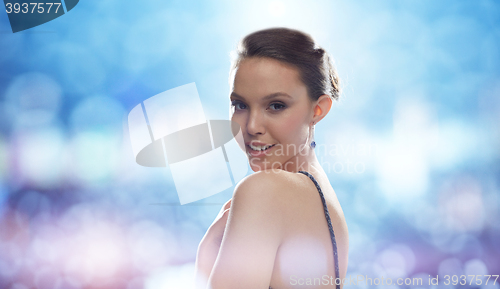 Image of beautiful young asian woman with earring