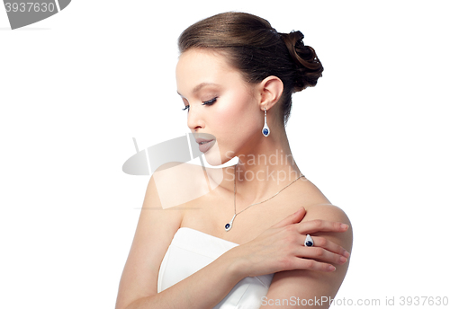 Image of beautiful woman with earring, ring and pendant