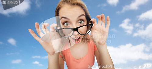 Image of happy young woman or teenage girl in eyeglasses