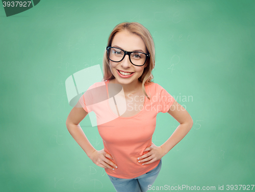 Image of happy young woman or teenage girl in eyeglasses