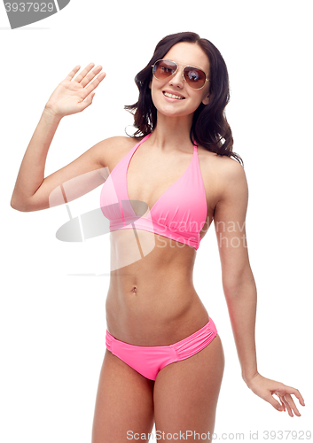 Image of happy woman in sunglasses and bikini swimsuit