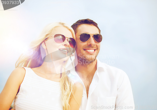 Image of happy couple in sunglasses