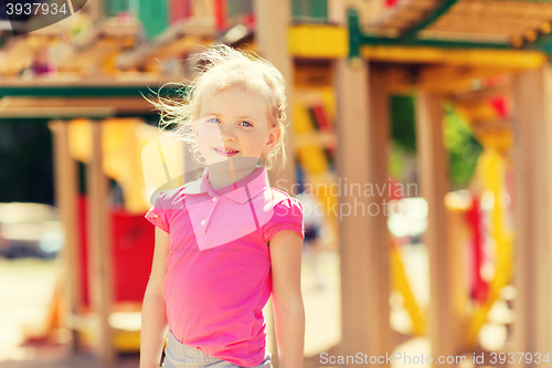 Image of happy little girl on children playground