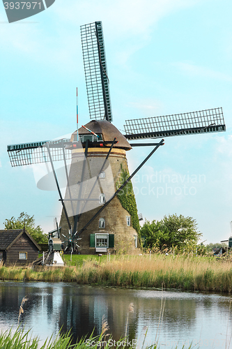 Image of Traditional Dutch windmills with green grass in the foreground, The Netherlands