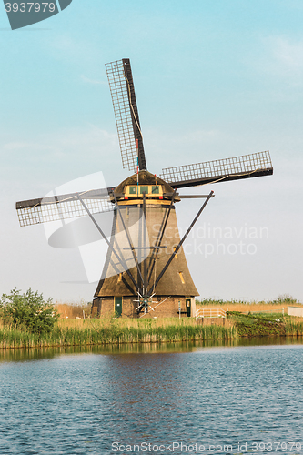 Image of Traditional Dutch windmills with green grass in the foreground, The Netherlands