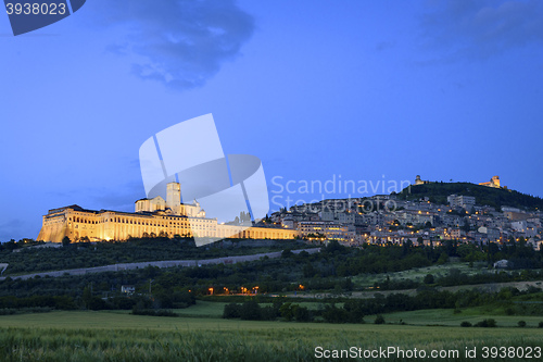 Image of Illuminated cityscape Assisi basilica and monastery 