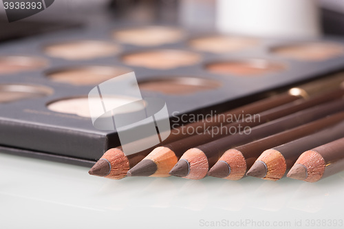 Image of shadows eye and eyebrow set on table