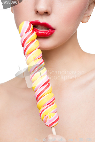 Image of Close-up shot of woman\'s mouth bright red lips with lollipop. blowjob simulation