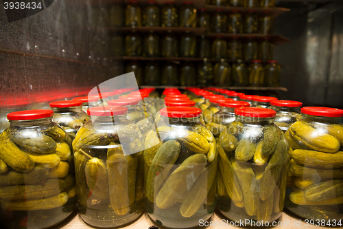 Image of gurtsov conservation. Fresh cucumbers in jars