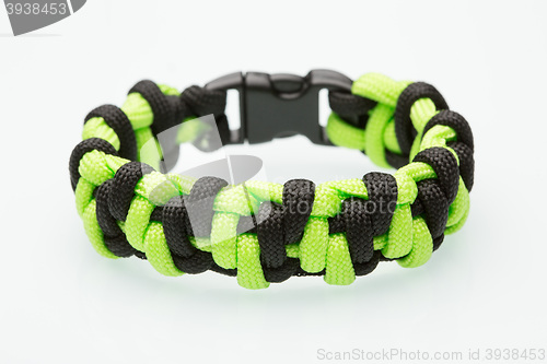 Image of green braided bracelet on white background