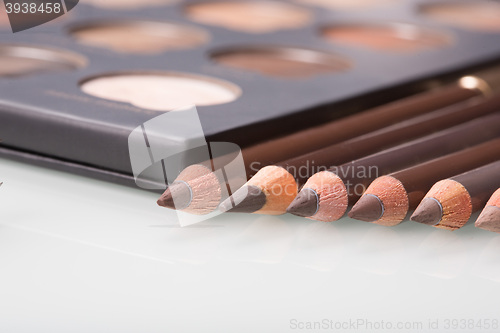 Image of shadows eye and eyebrow set on table