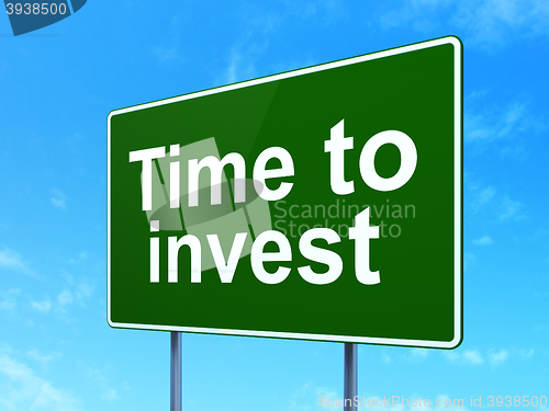 Image of Time concept: Time To Invest on road sign background