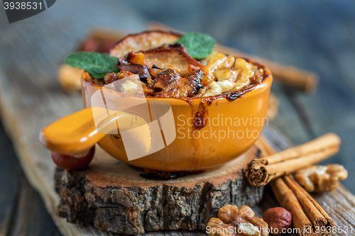 Image of Oatmeal baked apple for a healthy breakfast.