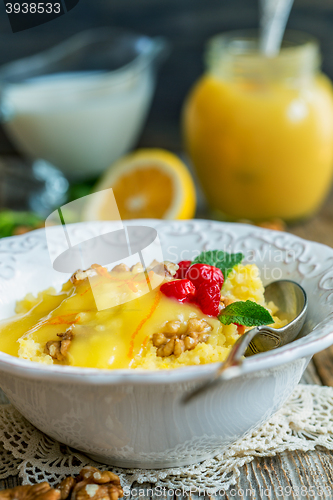 Image of Millet porridge with nuts and lemon cream for a healthy breakfas