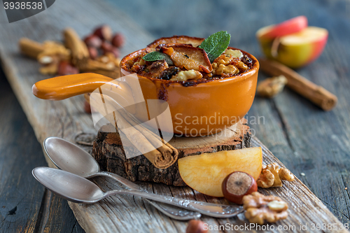 Image of Baked oatmeal with apple, cinnamon and nuts.