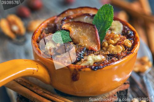 Image of Delicious baked oatmeal with apples, nuts and spices.