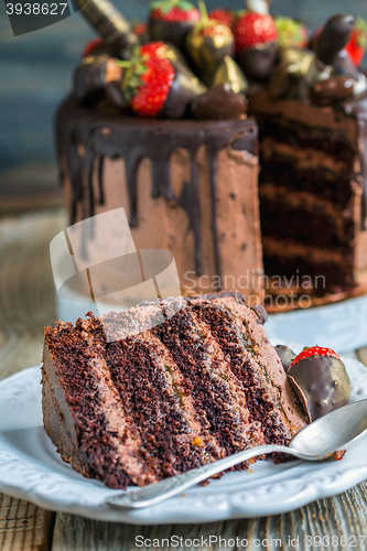 Image of Piece of delicious chocolate cake with strawberries.