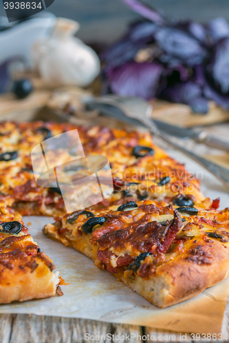 Image of Pizza with cheese, mushrooms and sausage.