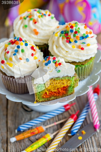 Image of Cupcakes and candles for the holiday cake.