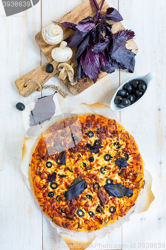 Image of Pizza with sausage and cheese. View from above.
