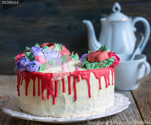 Image of Colorful cake with floral decoration.