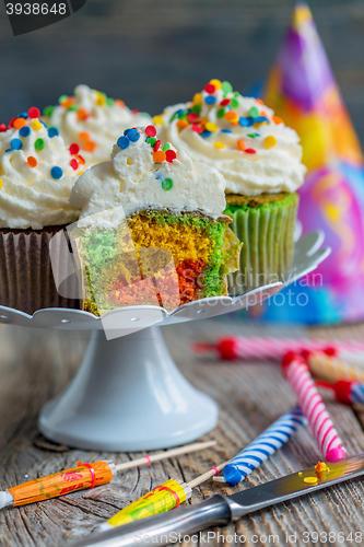 Image of Cupcakes with colorful sprinkles.