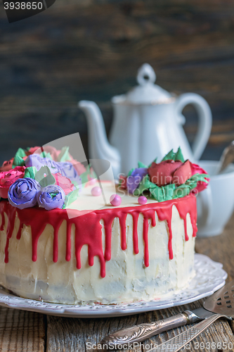 Image of Cake with flowers of cream for coffee.