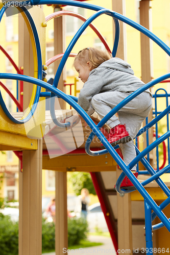 Image of girl playing at the playground