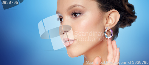 Image of close up of beautiful woman face with earring